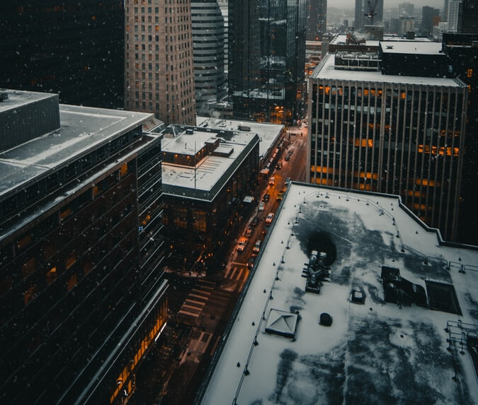 Aerial view of snow-capped flat roofs.