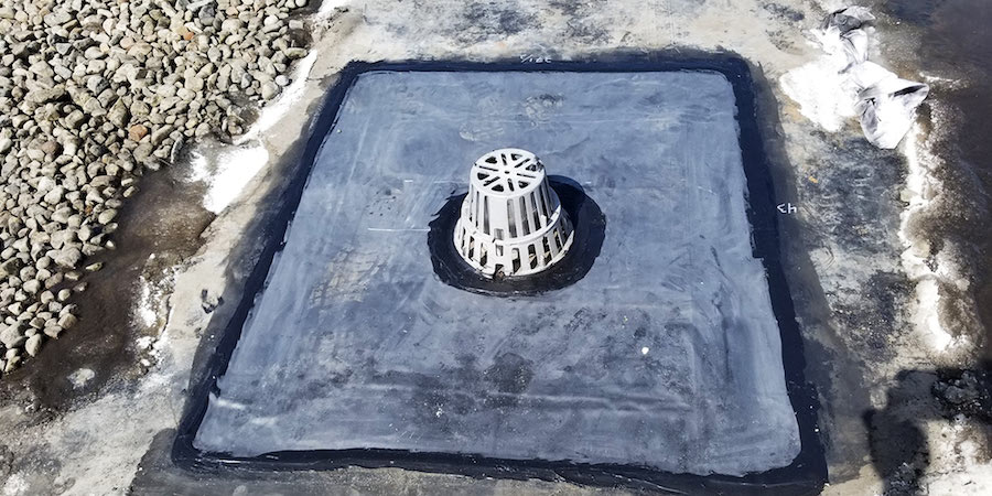 An unclogged flat roof drain