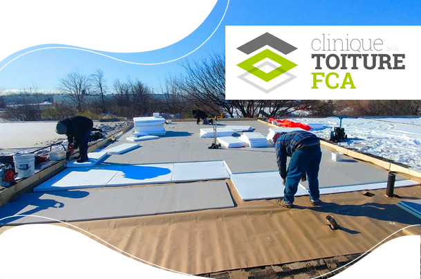 Workers insulating a flat roof from the outside.