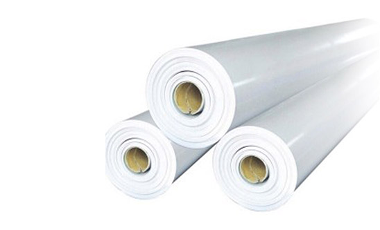 Three rolls of TPO flat roof membranes.