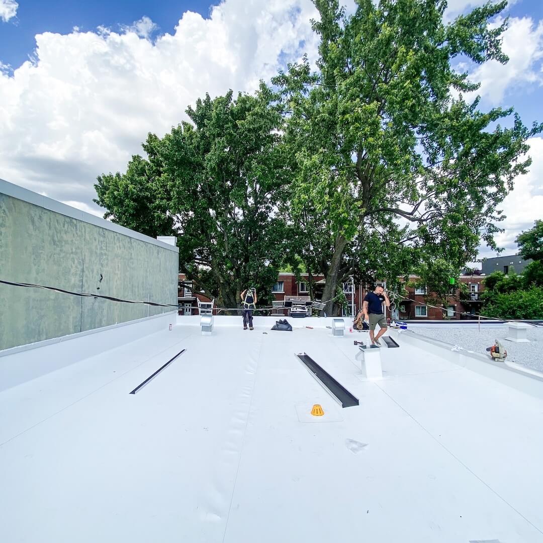A flat roof under construction for a business.